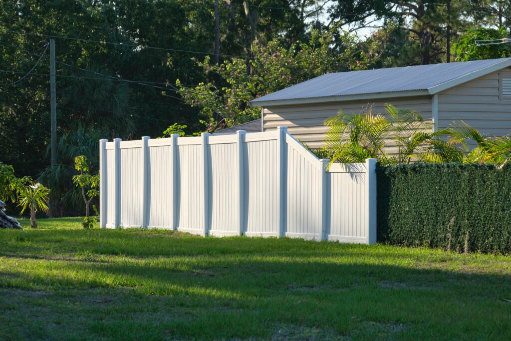 White plastic fence for back yard protection and privacy